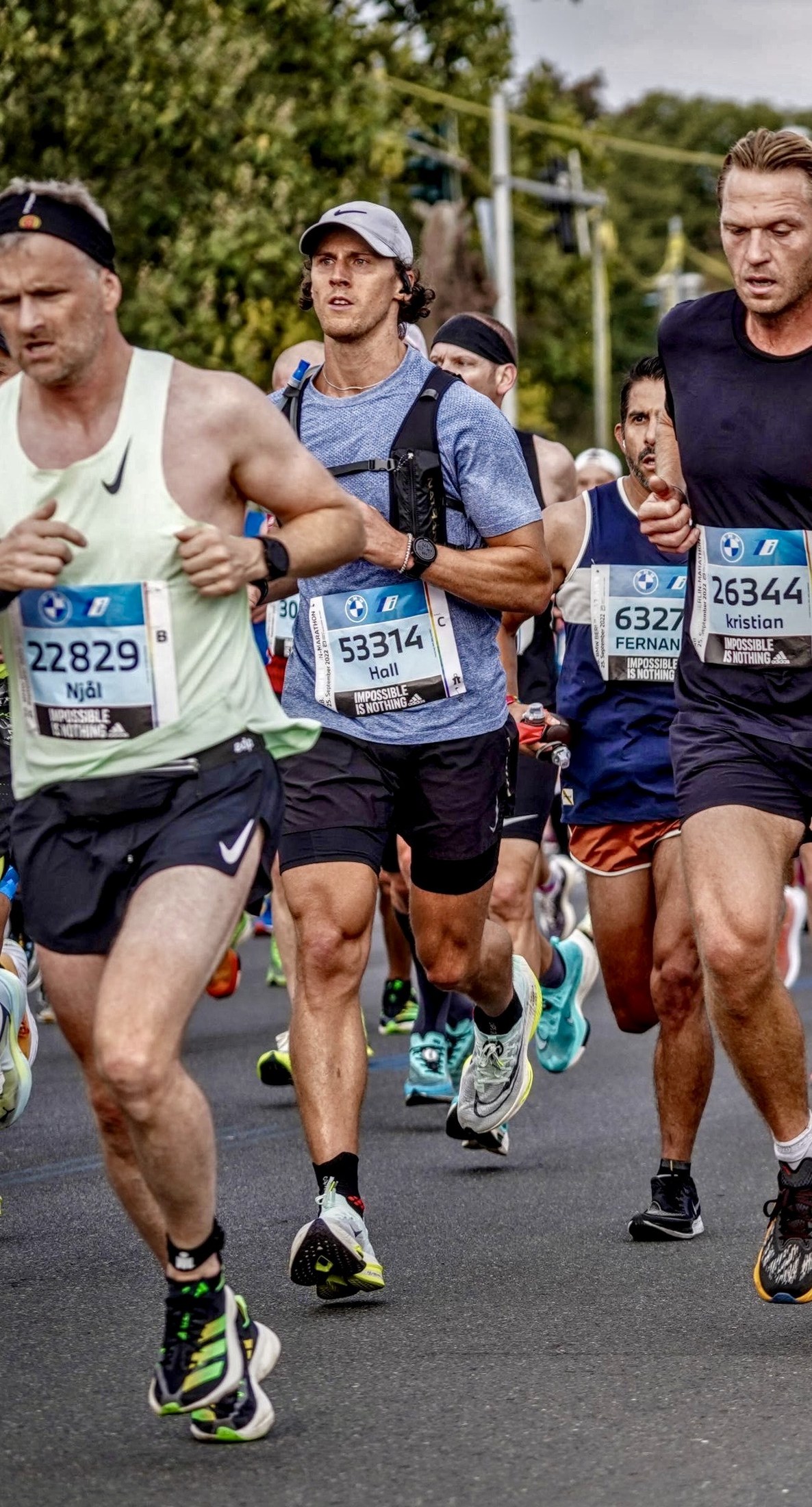 Hall Charter running with other runners in a road race